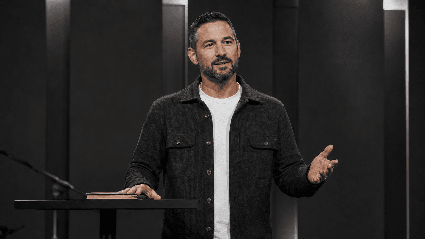 A pastor preaching on stage, reframed as a portrait sermon clip.